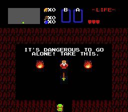 A screen shot from the 1986 video game Legend of Zelda showing the main character Link in a curiously rectangular cave.  An old man stands between two fires, and offers Link a sword.  