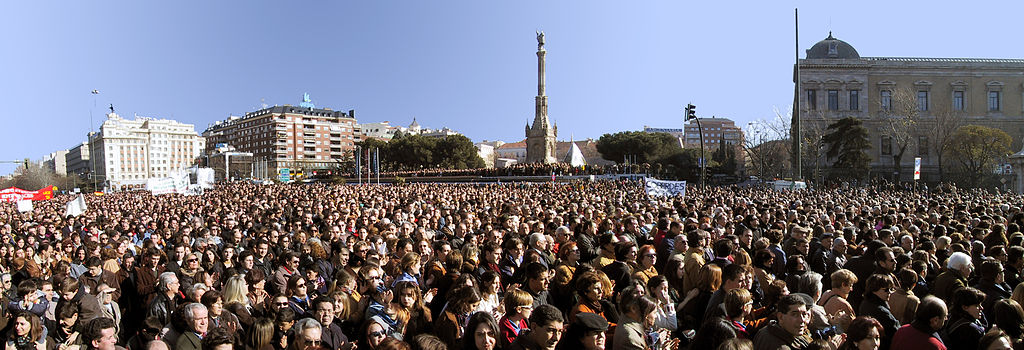 A picture showing part of a crowd of approximately 1 million people, with a monument in the background.  Your vote is one in a million and a third.  